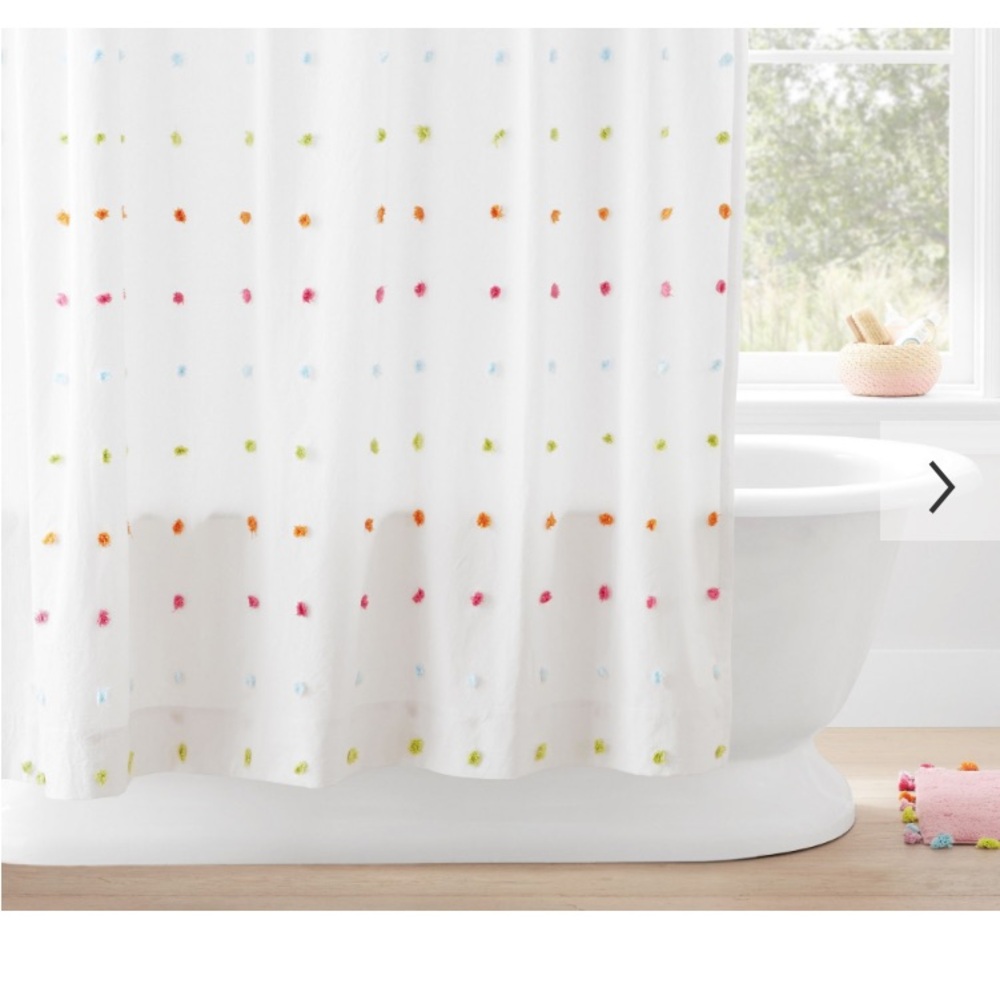 Pottery Barn Shower curtain. In almost mint condition.  Multi colored PomPoms